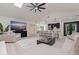 Open-concept living space with kitchen island, comfortable seating, and modern decor at 7108 Pelican Island Dr, Tampa, FL 33634