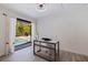 Bright home office featuring a view of the outdoor pool, and ample workspace at 7108 Pelican Island Dr, Tampa, FL 33634