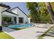 Beautiful backyard pool area, complete with comfortable lounge chairs and lush landscaping for relaxation at 7108 Pelican Island Dr, Tampa, FL 33634