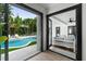 View of the pool from inside, showcasing the indoor-outdoor living at 7108 Pelican Island Dr, Tampa, FL 33634