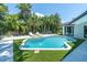 Aerial view of the pool, showing an amazing backyard great for entertaining and relaxing by the poolside at 7108 Pelican Island Dr, Tampa, FL 33634