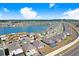 Wide aerial perspective showcasing a home near a serene lake within a well-planned residential area at 7929 Sail Clover Ln, Zephyrhills, FL 33540