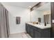 The bathroom boasts double sinks, a spacious counter, and a shower with neutral-toned accents at 7929 Sail Clover Ln, Zephyrhills, FL 33540