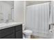 A well-maintained bathroom offers a clean and functional space with a sink, toilet, and shower at 7929 Sail Clover Ln, Zephyrhills, FL 33540