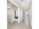 An inviting hallway provides seamless transition between rooms, accentuating the home's spacious layout at 7929 Sail Clover Ln, Zephyrhills, FL 33540