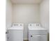 Dedicated laundry room with a washer and dryer at 7929 Sail Clover Ln, Zephyrhills, FL 33540