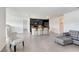 Spacious living room showcasing an open floor plan with kitchen and stylish furnishings at 7929 Sail Clover Ln, Zephyrhills, FL 33540
