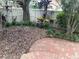 Backyard featuring lush greenery, a privacy fence and brick pavers at 826 Glades Ne Ct, St Petersburg, FL 33702