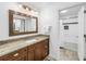 Bathroom with granite countertop and white subway tile in the shower and tub at 826 Glades Ne Ct, St Petersburg, FL 33702