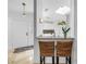 Breakfast bar overlooking the entryway, featuring pendant lighting and seating at 826 Glades Ne Ct, St Petersburg, FL 33702