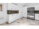 Kitchen with stainless steel refrigerator and white cabinets; lots of pantry space at 826 Glades Ne Ct, St Petersburg, FL 33702