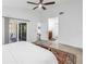Spacious main bedroom with ensuite, neutral walls, and sliding glass doors at 826 Glades Ne Ct, St Petersburg, FL 33702