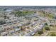 Expansive aerial view of a well-planned community, highlighting residential streets, homes, and landscaping at 832 Fox Hills Dr, Sun City Center, FL 33573