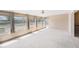 Bright lanai with lots of windows offering views of the backyard at 832 Fox Hills Dr, Sun City Center, FL 33573