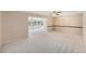 Bright living room with large windows and lots of open space to an enclosed lanai at 832 Fox Hills Dr, Sun City Center, FL 33573