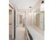 Bright vanity area with a mirror, lighting and a walk in closet at 832 Fox Hills Dr, Sun City Center, FL 33573
