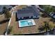 Aerial view featuring a modern pool and spa, enhancing the home's outdoor appeal at 926 Eagle Ln, Apollo Beach, FL 33572