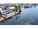 Aerial view of a waterfront home with modern pool and lush landscaping at 926 Eagle Ln, Apollo Beach, FL 33572