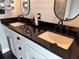 Modern bathroom showcasing a double vanity with sleek black fixtures and ample counter space at 926 Eagle Ln, Apollo Beach, FL 33572