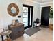 Bright entryway showcases modern doors, decorative mirror, and tasteful furnishings at 926 Eagle Ln, Apollo Beach, FL 33572