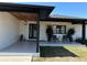 Stylish front porch with decorative tiles, comfortable seating, and a welcoming entrance at 926 Eagle Ln, Apollo Beach, FL 33572