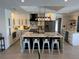 Modern kitchen with a large island, white cabinets, and stainless steel appliances at 926 Eagle Ln, Apollo Beach, FL 33572