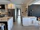 Open floor plan showing the transition from kitchen to living room, highlighted by modern design and decor at 926 Eagle Ln, Apollo Beach, FL 33572