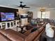 Bright living room featuring a large sectional sofa, a fish tank, and a cozy atmosphere at 926 Eagle Ln, Apollo Beach, FL 33572