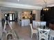 Open floor plan showcasing the kitchen with island, dining area, and living room in a modern home at 926 Eagle Ln, Apollo Beach, FL 33572