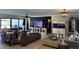 Spacious living room with a comfortable leather sectional and a large entertainment center at 926 Eagle Ln, Apollo Beach, FL 33572