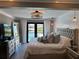Bright main bedroom with water view from french doors leading to backyard pool at 926 Eagle Ln, Apollo Beach, FL 33572