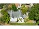 Aerial view showcasing a home with a well-maintained yard and a unique sunroom, surrounded by greenery at 101 22Nd N Ave, St Petersburg, FL 33704