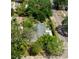 An aerial view shows a well-maintained home among mature trees on a tree-lined street at 101 22Nd N Ave, St Petersburg, FL 33704