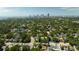 Expansive aerial view showcasing residential homes nestled among lush trees, with a city skyline in the backdrop at 101 22Nd N Ave, St Petersburg, FL 33704