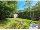 Backyard features a small storage house with lovely landscaping at 101 22Nd N Ave, St Petersburg, FL 33704