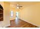 Bedroom with yellow walls, ceiling fan, hardwood floors, and a window at 101 22Nd N Ave, St Petersburg, FL 33704