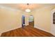 Traditional dining room with hardwood floors, decorative ceiling light, and arched doorway to the next room at 101 22Nd N Ave, St Petersburg, FL 33704