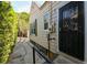 Side view of the home featuring a secure black front door at 101 22Nd N Ave, St Petersburg, FL 33704
