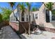 Rear view of the home featuring well-maintained brick and ample sunlight at 101 22Nd N Ave, St Petersburg, FL 33704