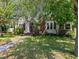 Charming home with a brick chimney, cozy front entrance, and beautiful landscaping at 101 22Nd N Ave, St Petersburg, FL 33704