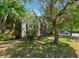 Quaint home with mature trees, landscaping, a brick chimney and well-kept lawn at 101 22Nd N Ave, St Petersburg, FL 33704