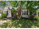 Charming home with a brick chimney, cozy front entrance, and beautiful mature landscaping at 101 22Nd N Ave, St Petersburg, FL 33704