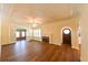 Bright living room with wood floors, fireplace, a ceiling fan, and an arched doorway at 101 22Nd N Ave, St Petersburg, FL 33704