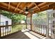 Outdoor porch with ceiling fan and screen door overlooking the green backyard and shed at 101 22Nd N Ave, St Petersburg, FL 33704