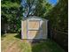 Backyard features a small storage house and attractive landscaping at 101 22Nd N Ave, St Petersburg, FL 33704