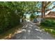 Quiet neighborhood street featuring mature trees and glimpses of charming homes, offering a peaceful setting at 101 22Nd N Ave, St Petersburg, FL 33704