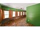 Bright sunroom with brick accents, tile flooring, and large windows for natural light at 101 22Nd N Ave, St Petersburg, FL 33704