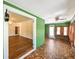 Spacious view of a sunroom leading to an adjacent room through white trimmed doorways at 101 22Nd N Ave, St Petersburg, FL 33704