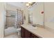 Bathroom with a shower-tub combo, toilet and vanity with sink at 10511 Mistflower Ln, Tampa, FL 33647