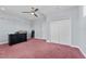 This spacious bedroom features a ceiling fan, large closet, and ample room for furnishings at 10511 Mistflower Ln, Tampa, FL 33647